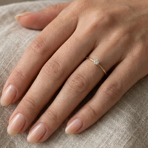 Radiant Tiny Solitaire Ring.